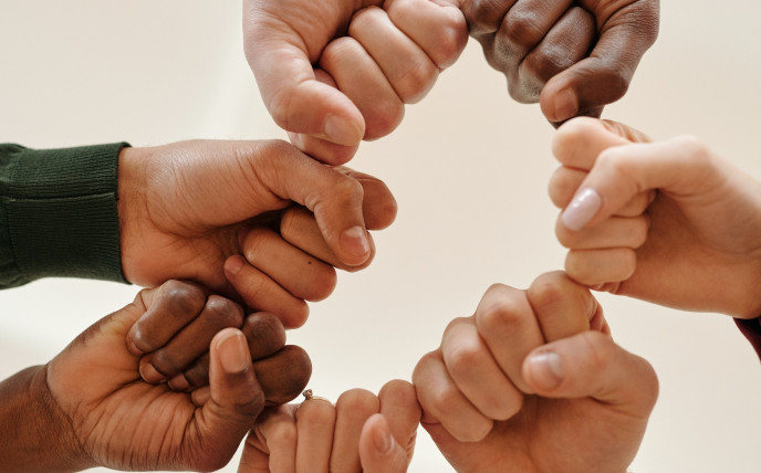 Fists of people with different skin tone